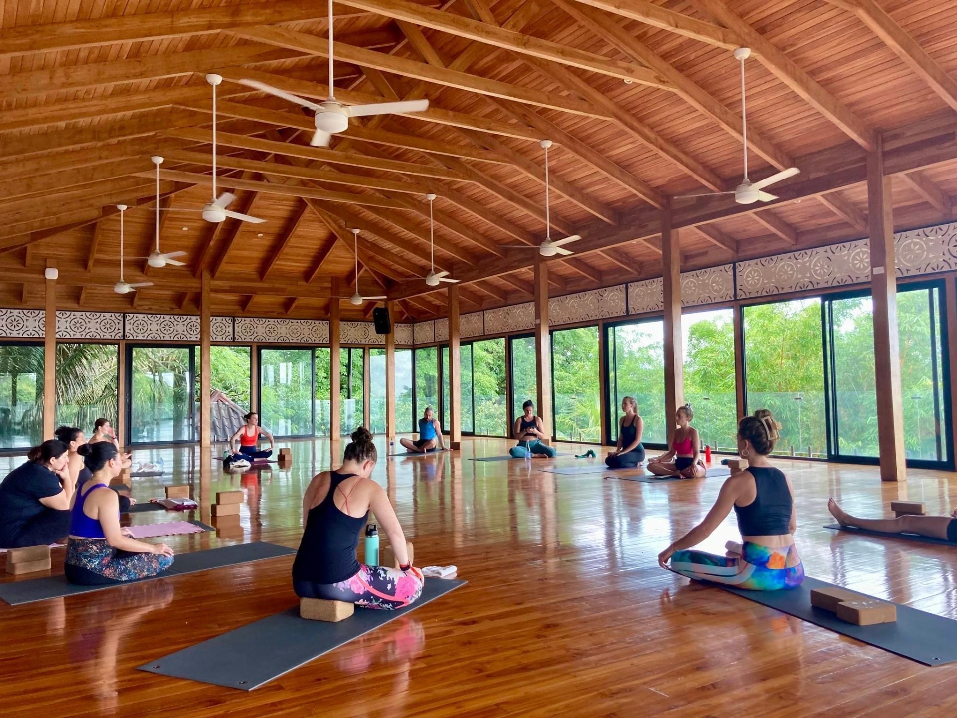 Ellery Long leading a yoga class in an open pavilion