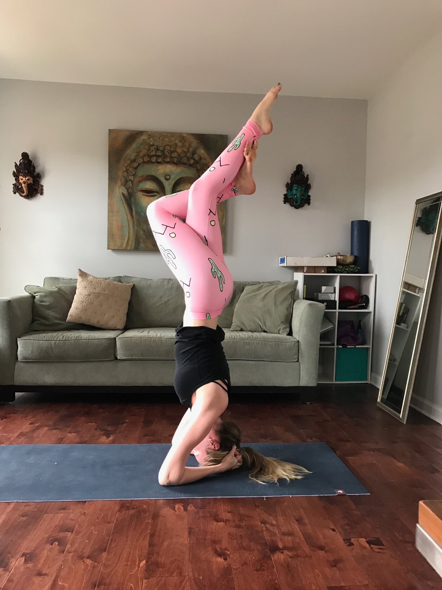 Ellery Long in a headstand at home